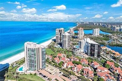 Aerial view with a water view and a beach view