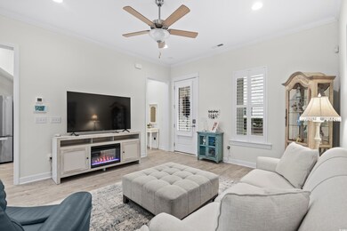 Living room with light hardwood / wood-style floor