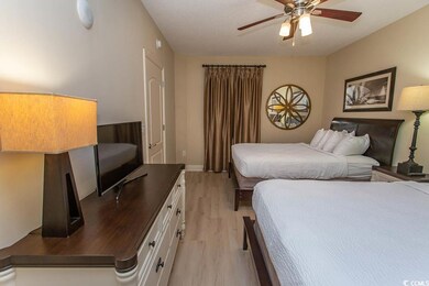 Bedroom featuring ceiling fan and light hardwood /