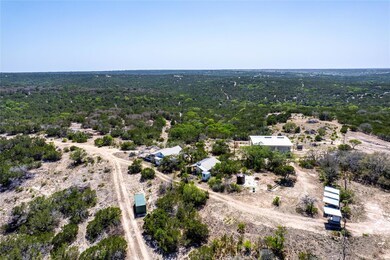Birds eye view of property with a forest view