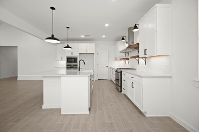 Kitchen with matte black pendant lighting