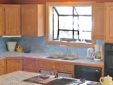 Atrium window over kitchen sink.