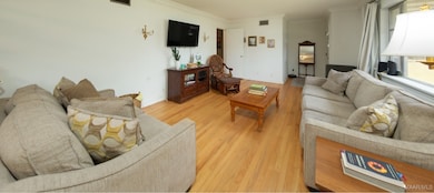 FORMAL LIVING ROOM AND THE ENTRY FOYER