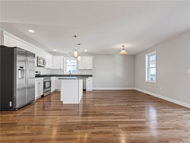 GRANITE KITCHEN WITH STAINLESS STEEL APPLIANCES.