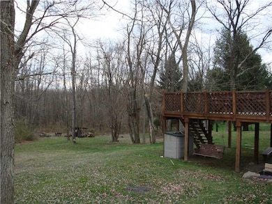 Patio/Deck. Back yard area  has a deck... mature t