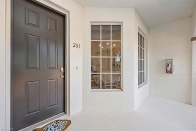 Doorway to property with stucco siding