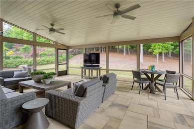 Beautiful screened-in patio features dual ceiling 