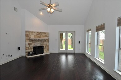 Unfurnished living room featuring high vaulted ce