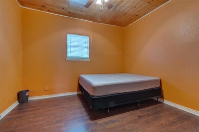 Bedroom featuring wooden ceiling, ceiling fan, and