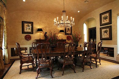 In the formal dining room you ll find silk Scalamandre drapes, antiqued mirror panels, and a crystal chandelier that mirrors the one hanging in the formal living room. They were custom made by David Iatesta.