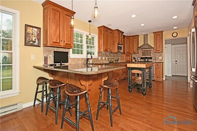 The kitchen features quartz countertops, stainless