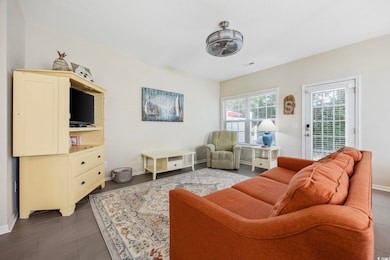 Living area featuring baseboards