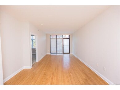 Bamboo flooring fill this large living and dining 