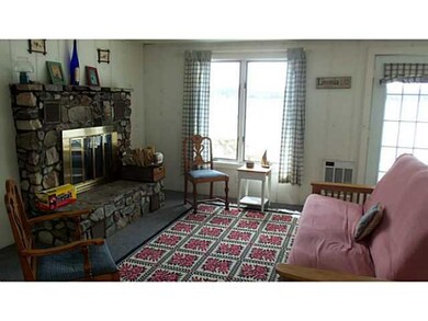 Living Room Wonderful stone fireplace & lake views