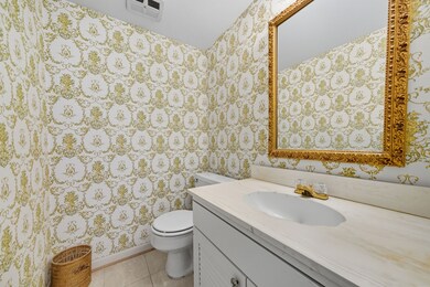 Half bathrooms conveniently located between the living room and the dining room