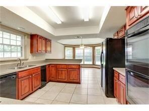 kitchen to breakfast area, with bay window