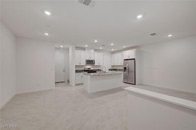 Kitchen with stainless steel appliances, recessed