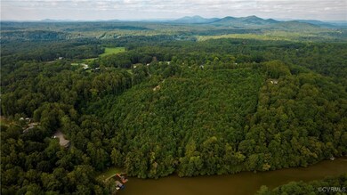 Birds eye view of property with a water and mounta