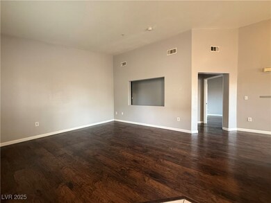 Unfurnished room with baseboards, dark wood finish