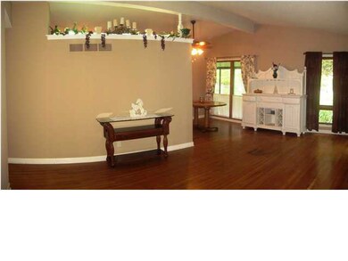 Living Room with hardwood floors and large windows