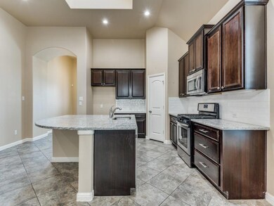 Entry and kitchen with large island