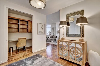 Corridor featuring baseboards and wood finished f