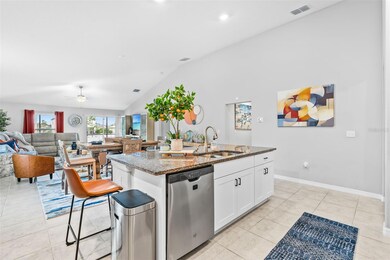 Central granite island with sink and dishwasher 13557 Willow Bluestar Lp, Riverview, FL 33579