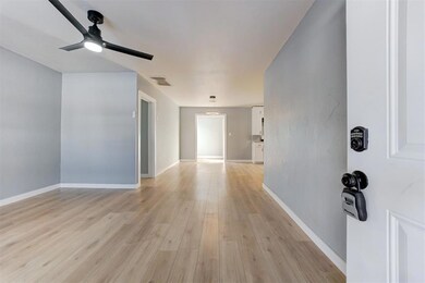 Spare room featuring baseboards, visible vents, a 
