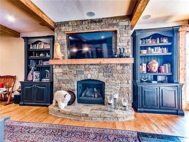 Gorgeous Stacked Rock Fireplace with built ins on 