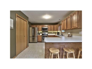 Kitchen. LARGE PANTRY CLOSET AND BREAKFAST BAR.