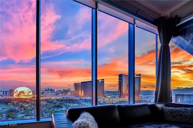 Living area with a view of city and crown molding