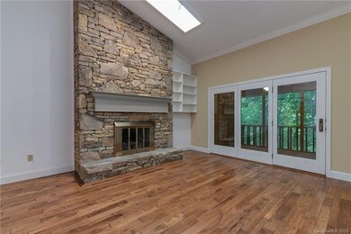 Vaulted ceiling with skylights in great room and access to screened porch