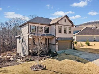 Craftsman inspired home with covered porch, board and batten siding, concrete driveway, a garage, and brick siding