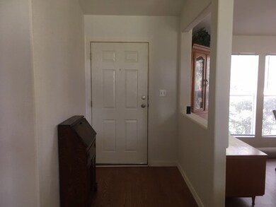 Separate entry separates the formal dining and opens into a huge den.