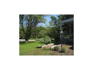 Facade/Exterior Front. View from Front yard to str
