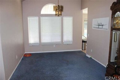 Formal dining room showing kitchen entry door