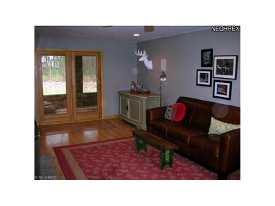 Family room opens to kitchen and doors to back por