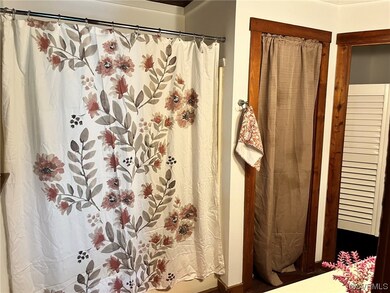 Bathroom featuring shower curtain