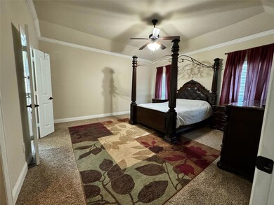 Bedroom featuring carpet floors and ceiling fan