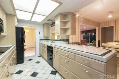 Custom tile kitchen with pass through window to fa