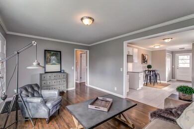 The spacious living room is open to the kitchen