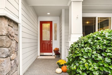 A welcoming front porch with seating area.