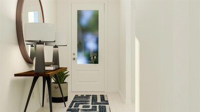 Doorway featuring baseboards