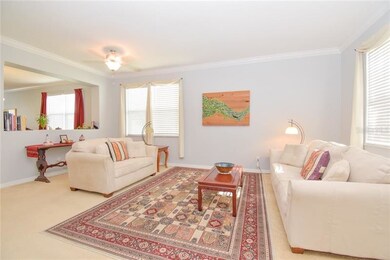 Open and airy living room with crown molding