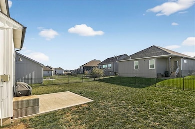Fenced backyard featuring a patio and a residential view