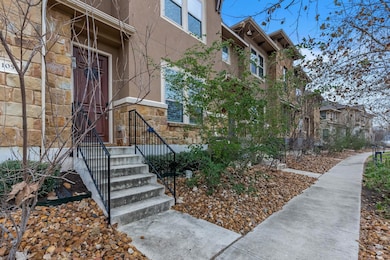 Property entrance with stone siding and stucco si