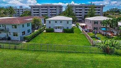 Exterior Back with large backyard adjacent to Normandy Shores golf course; possible potential for further development.