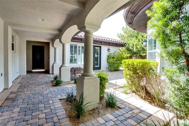 Front entry leads to beautiful courtyard with pave