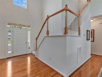 Wonderful spacious foyer with hardwood floor.