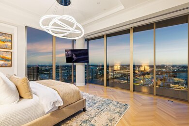 Spacious primary bedroom suite has adjacent sittin